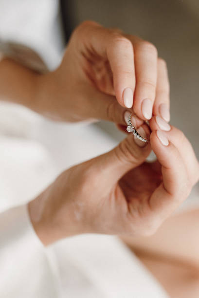 istock the bride is holding an engagement ring with precious stones 1295090964