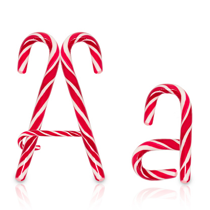 Candy cane in shape of letter A isolated on white background.