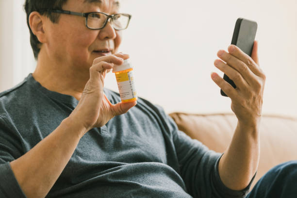 istock Senior man discusses medication during telemedicine appointment 1295099830