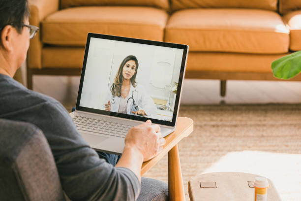 istock Female doctor participates in virtual appointment with patient 1295099851