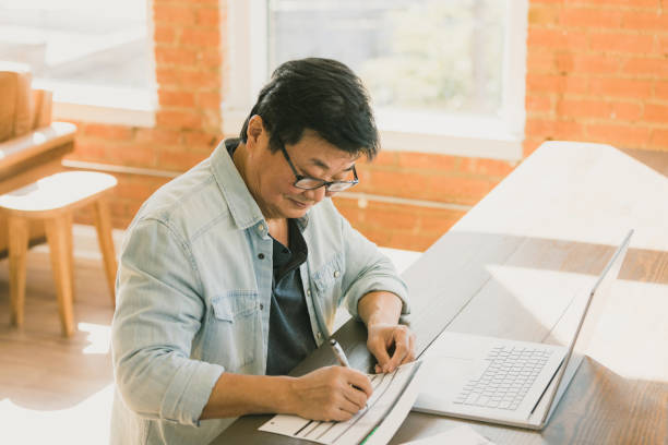 istock Senior man working on budget at home 1295099865