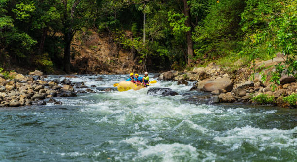 istock Navigating the river rapids in Costa Rica 1295104576
