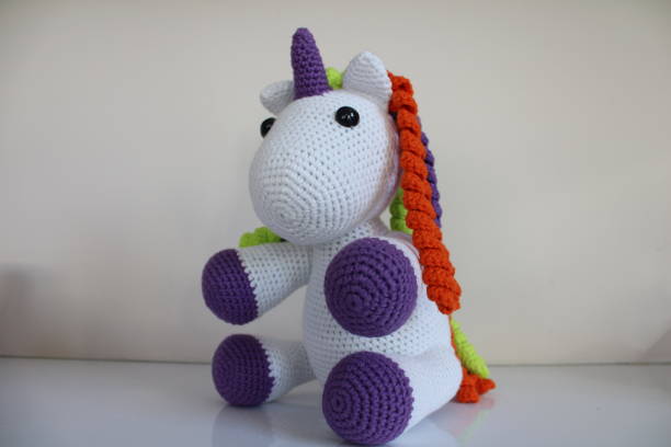 istock Unicorn in purple and white colors. 1295105776
