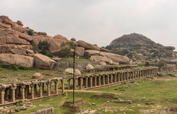 istock Diagonal ruinous gallery at Krishna Tank, Hampi, Karnataka, India. 1295113058