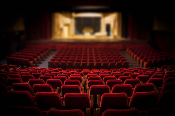 Empty red armchairs of a theater ready for a show Empty red armchairs of a theater ready for a show competition round stock pictures, royalty-free photos & images