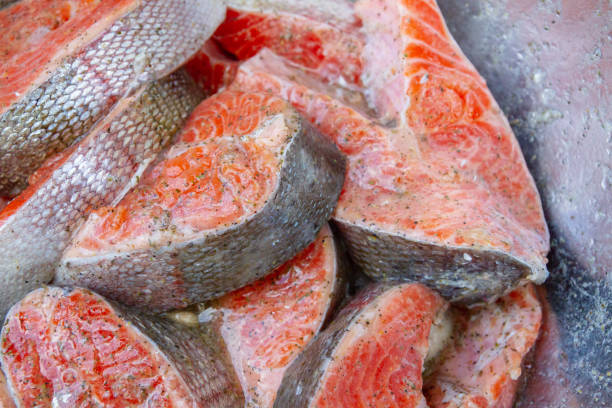 istock Fresh trout steaks are marinated in a metal bowl before cooking 1295120230