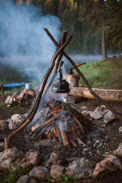 istock Campfire With A Vintage Teapot With Herbal Tea Over It 1295131734