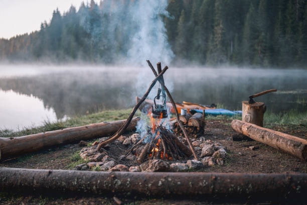 istock Campfire With A Vintage Teapot Next To The Lake 1295131744