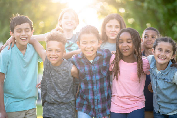 istock Multi ethnic group of elementary age children outdoors 1295132331