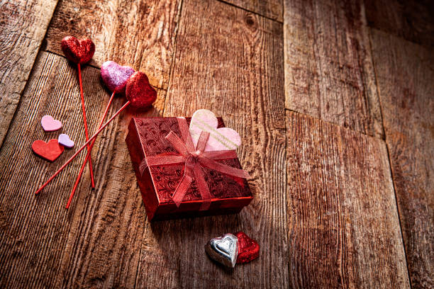 istock Valentines Day Gift and Decorations for a Party on Retro Wood Background 1295136880