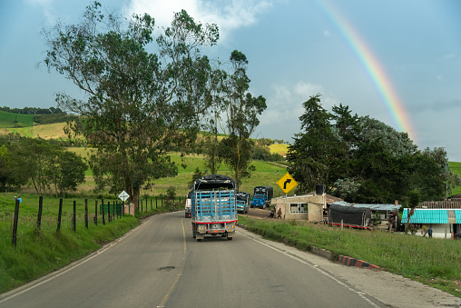 Traffic of small trucks on a rural route in the department of Boyaca, a department where there is a lot of potato cultivation. Boyaca. Colombia. November 18, 2020.
