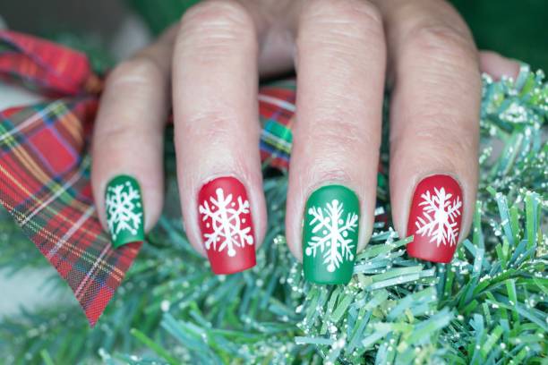istock Christmas Snowflake Nail Art Design 1295147015
