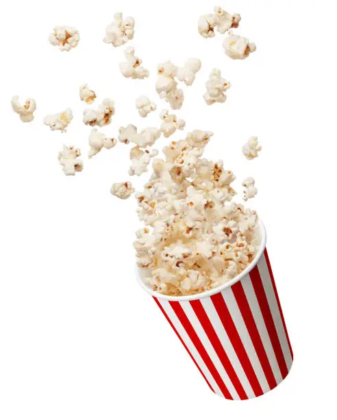 bucket of popcorn splashing isolated on white