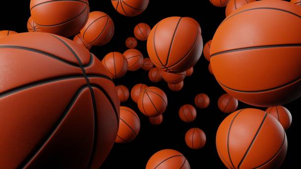 istock Many basketball balls on black background. 1295172506