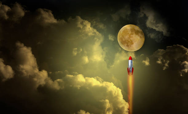 istock moon missile spacecraft in the night sky clouds light fire dream - 3d rendering 1295176636