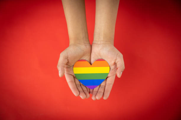 istock hands holding LGBT hearts, valentine's day concept 1295185582