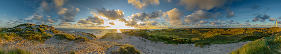 Panoramic shot of beach with blue sky and white clouds. Location: Island Helgoland Düne, Schleswig-Holstein, Germany.