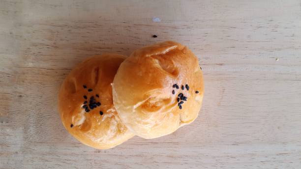istock Taro filled bun on wood background. 1295195349