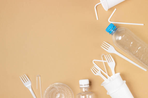 istock Plastic dishes, bottles, glasses on a white table. Planet pollution 1295204596