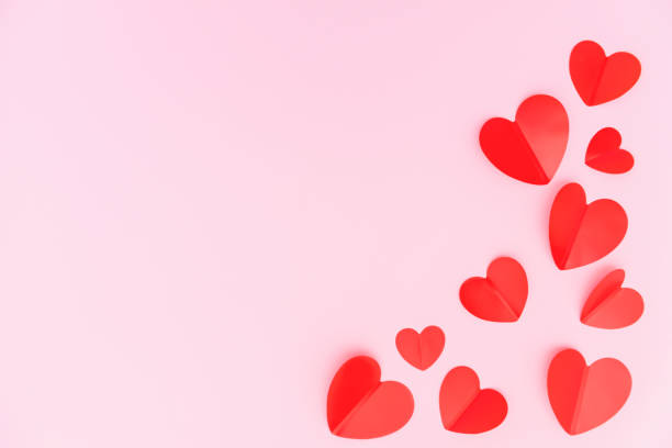 istock Paper craft hearts on pink background. 1295206044