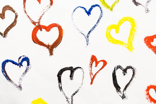 istock Background from hearts. Hearts are painted with multi-colored paints. 1295206170