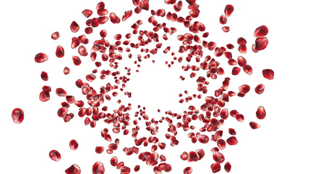 vortex of pomegranate grains fly in a circle creating a swirl