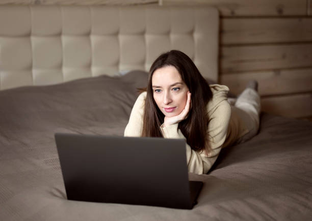 istock The girl works at the computer from home. 1295207609