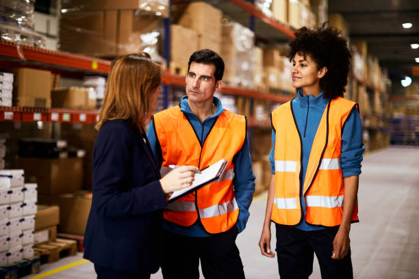 istock Warehouse coworkers in a meeting. 1295207899
