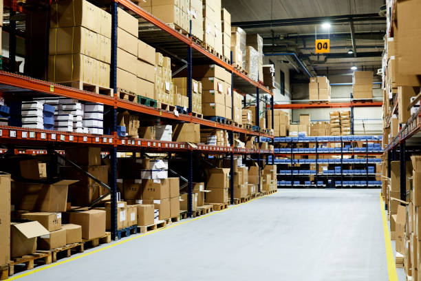 istock Warehouse aisle with no people. 1295207923