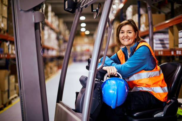 istock Manual workers portrait looking at the camera in a warehouse. 1295207950