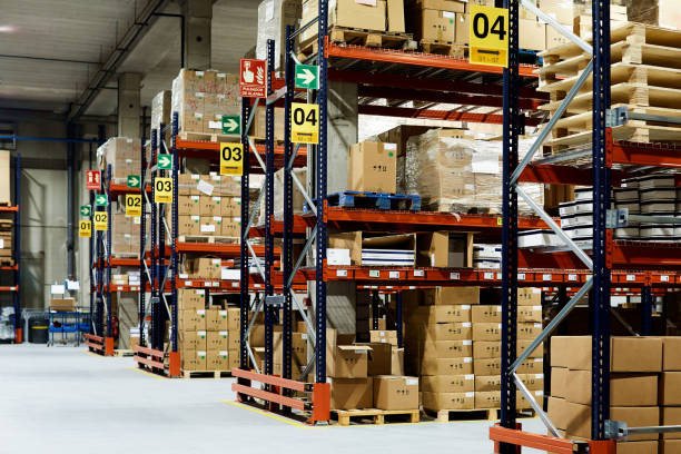 istock Warehouse aisle with no people. 1295208123