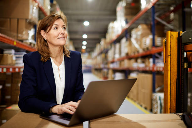istock Working at the Warehouse with a laptop. 1295208149