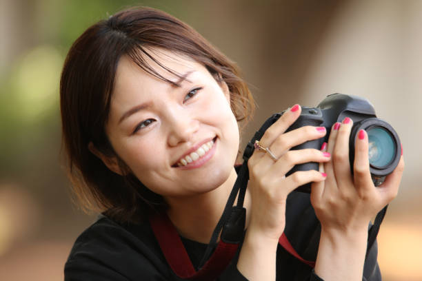 istock Woman taking a picture 1295210801