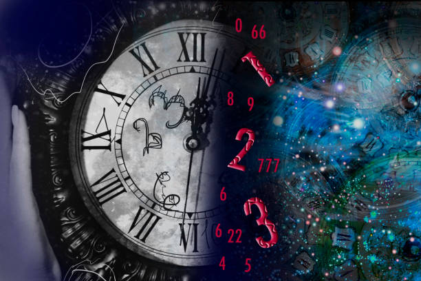 istock Hand holds a clock on the background of space and numerology 1295214127