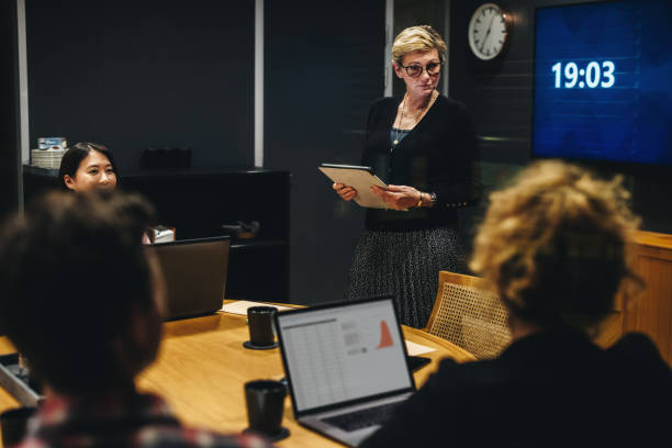 istock Staff briefing in office boardroom 1295214751