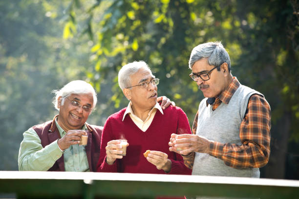 istock Senior men enjoying hot tea at park 1295215217