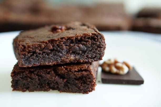 istock dark chocolate brownie piece with walnut 1295218780