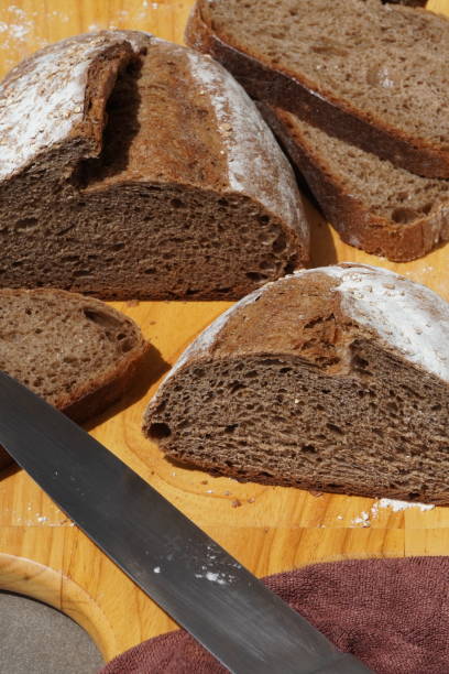 istock Artisan sourdough rye bread on wooden cutting board 1295218837