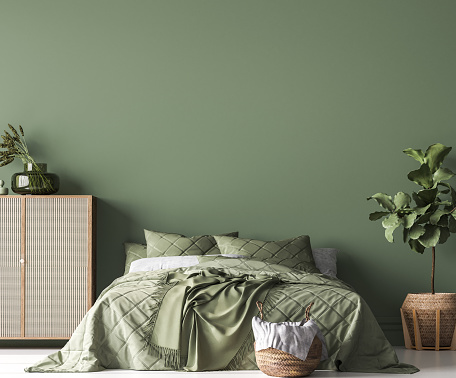 Boho Chic bedroom, simple and comfortable design with trendy rattan home accessories on green wall mockup
