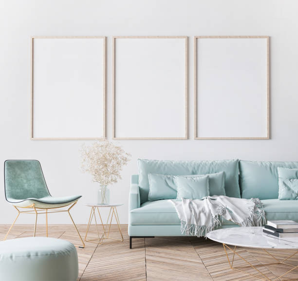 istock Frame mockup in bright modern living room design, three vertical wooden frames on white wall background 1295219430