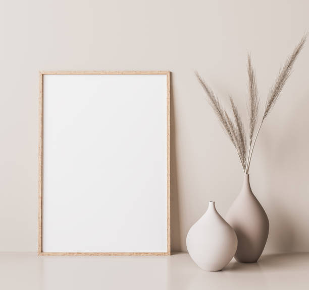 Vertical wooden frame mock up. Wooden frame poster Vertical wooden frame mock up. Wooden frame poster, and simple vase with pampas on beige wall. boho photos stock pictures, royalty-free photos & images