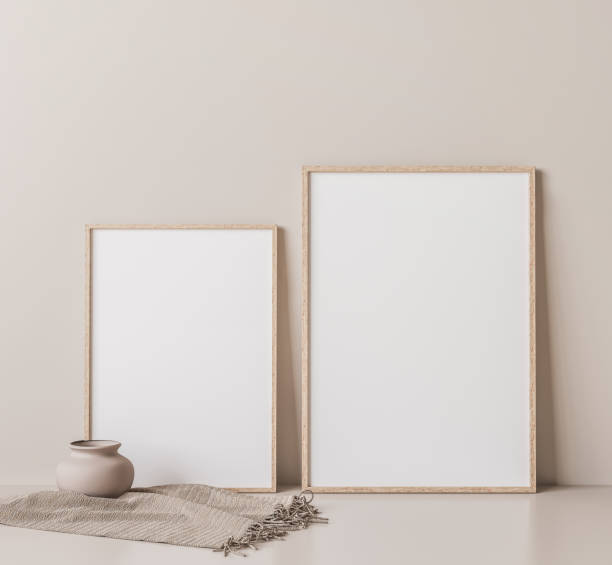 istock Frame mock up in empty room on beige wall, two vertical wooden frames 1295220295
