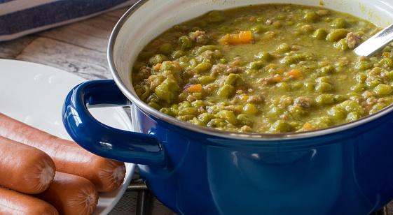fresh cooked pea soup or stew in retro, vintage pot. Close up view