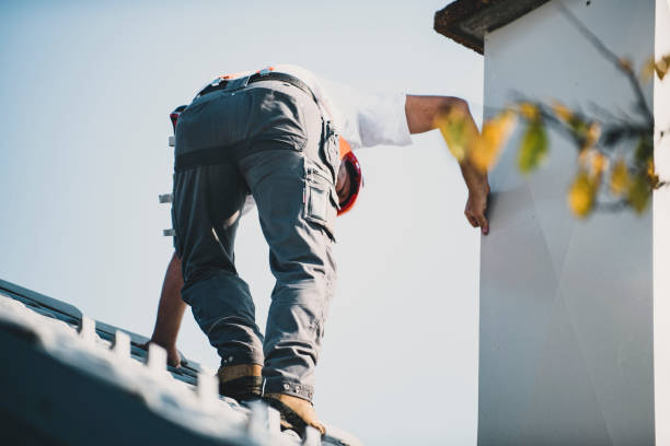 istock Roofer measuring chimney on roof top 1295220920