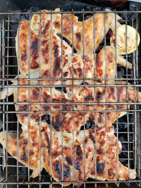 istock Close up barbecue chicken on grill 1295223381
