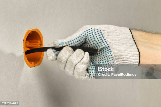 Cable Into Socket Master Conducts The Electrical Cable Into The Socket Box Stock Photo ...
