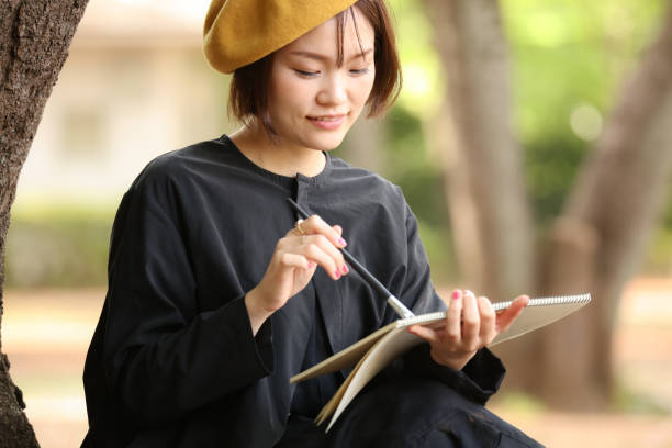 istock Woman drawing a picture 1295225294