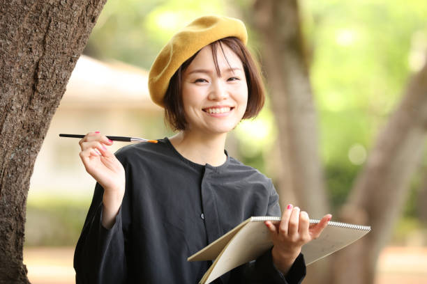 istock Woman drawing a picture 1295225851