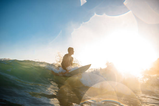 istock Gold Coast Surfer Catching a Wave at Sunrise 1295227248
