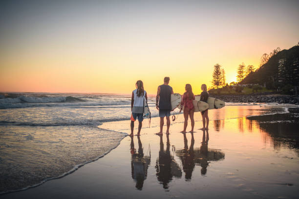 istock Gold Coast Surfers Checking Out Waves from Beach at Dawn 1295227251